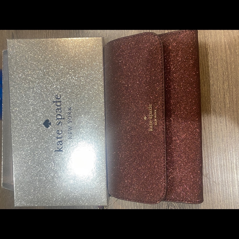 Wallet from Kate spade. New still in a box and with tag.